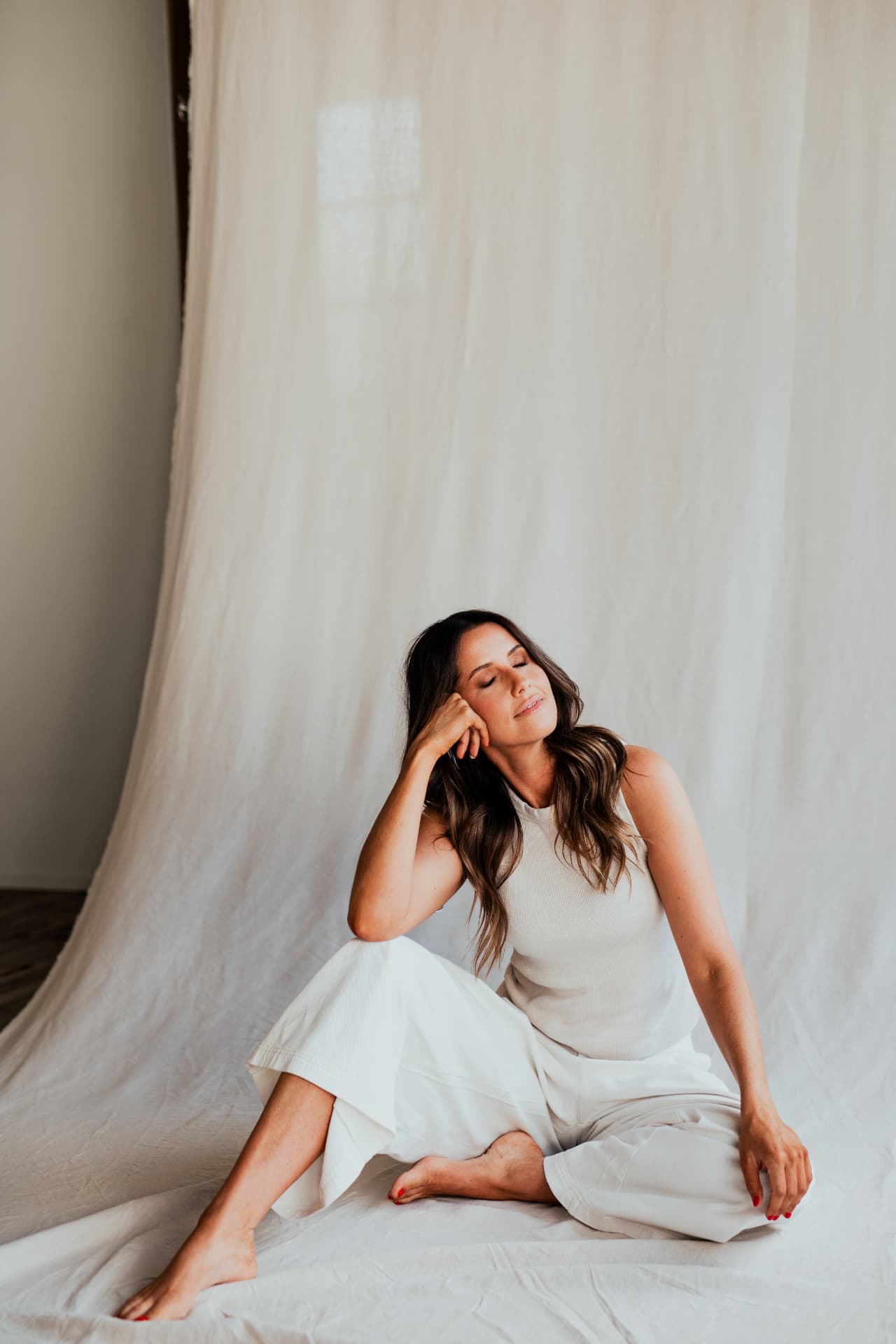 Amy Lea seated in soft natural light